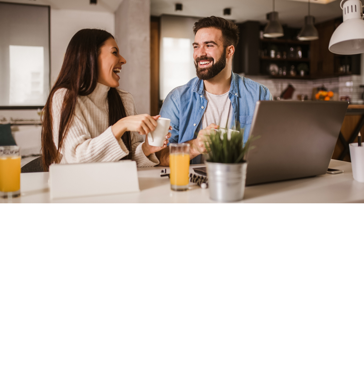 a man and a woman looking at each other laughing