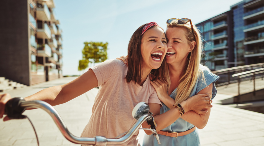 two women laughing and smiling