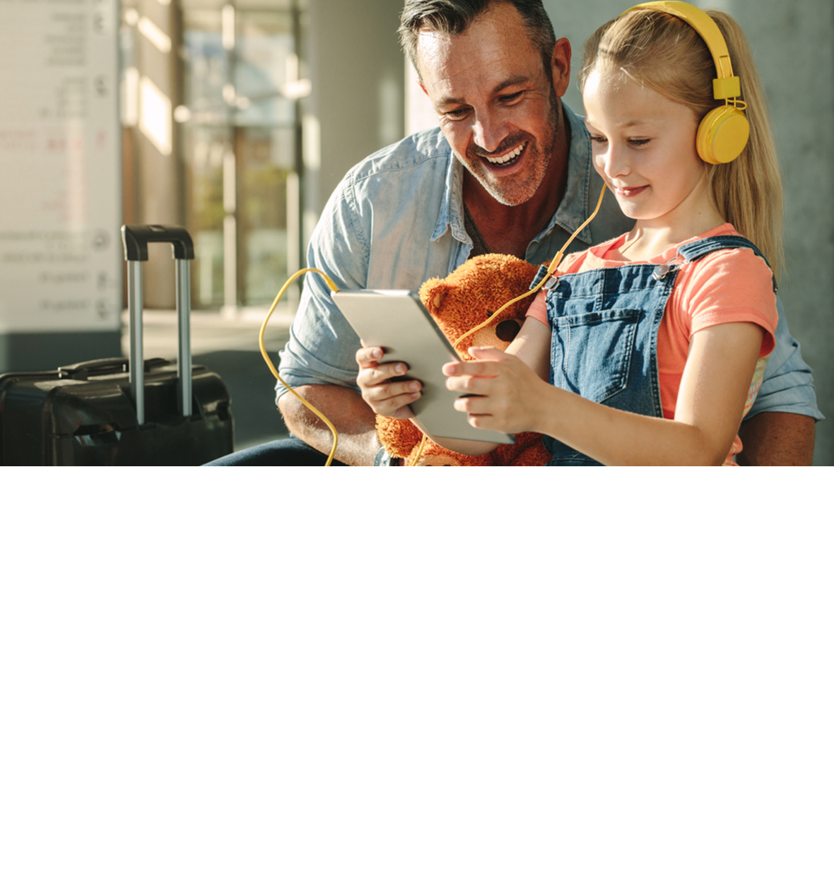 Girl with dad looking at ipad